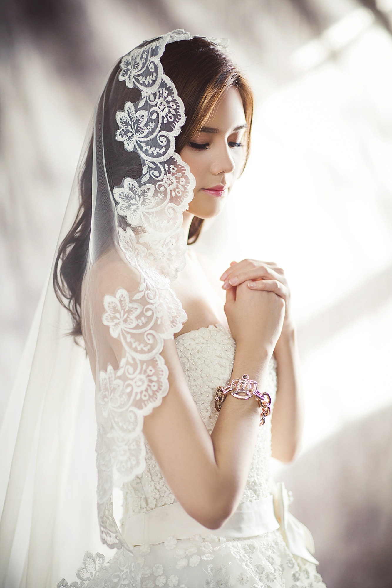 woman-in-white-bridal-gown-meditating-157757